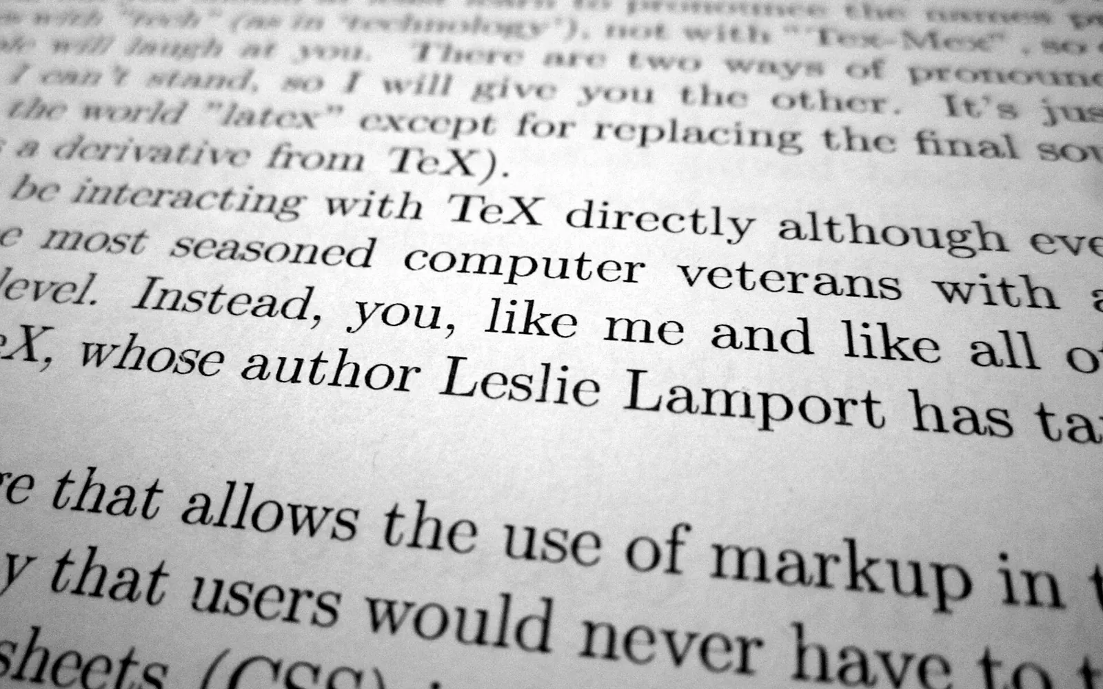 Close-up of black text printed on a sheet of white paper