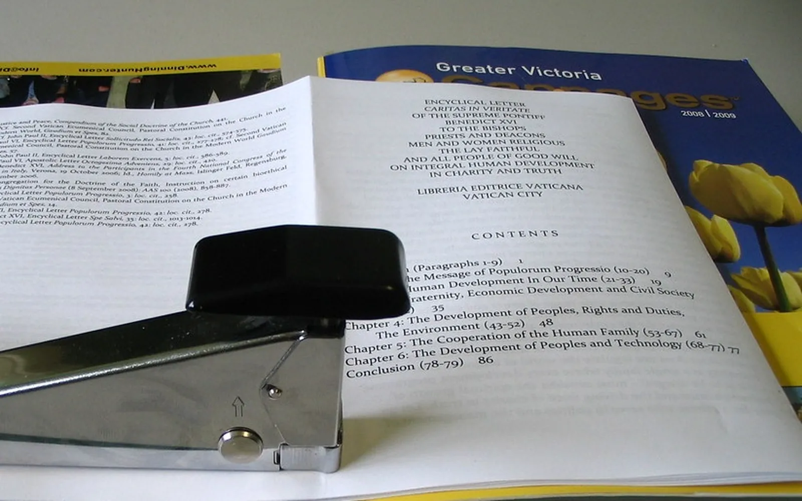A small printed booklet stapled along its folded spine